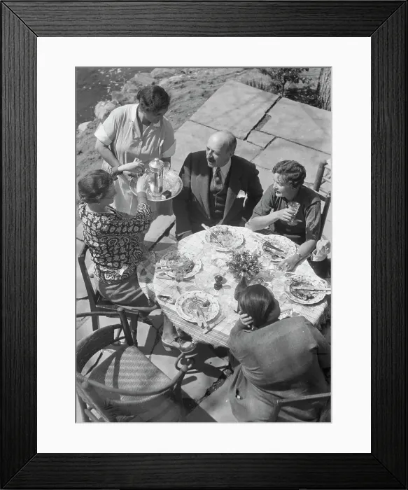 Framed Print : Mrs. Mary Benson and other people seated outdoors, 1933. Creator: Arnold Genthe Framed Print : Mrs. Mary Benson and other people seated outdoors, 1933. Creator: Arnold Genthe