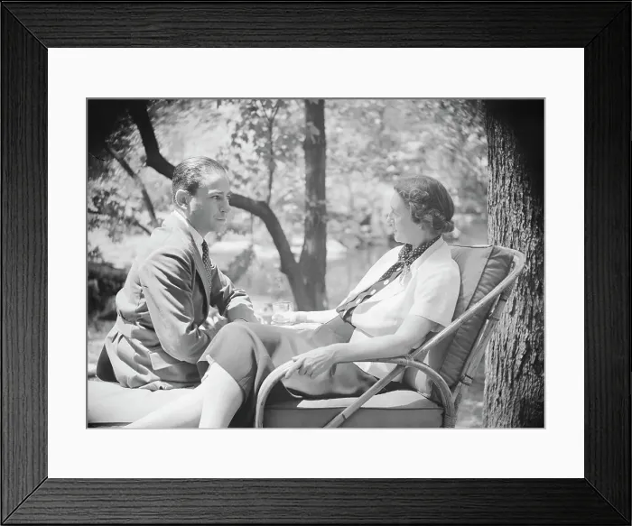 Framed Print : Mrs. Mary Benson and unidentified man, seated outdoors, 1933. Creator: Arnold Genthe