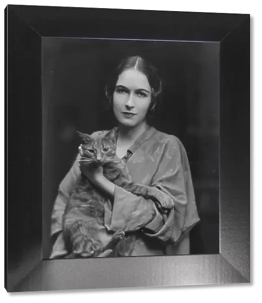 Pujo, Mona, Miss, with Buzzer the cat, portrait photograph, 1916. Creator: Arnold Genthe