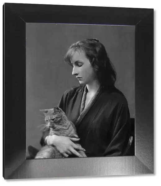 Whittaker, Miss, with Buzzer the cat, portrait photograph, 1916. Creator: Arnold Genthe