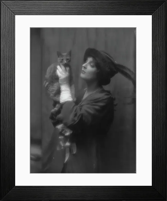 Framed Print : Cowl, Jane, Miss, with Buzzer the cat, portrait photograph, between 1912 and 1914. Creator: Arnold Genthe Framed Print : Cowl, Jane, Miss, with Buzzer the cat, portrait photograph, between 1912 and 1914. Creator: Arnold Genthe