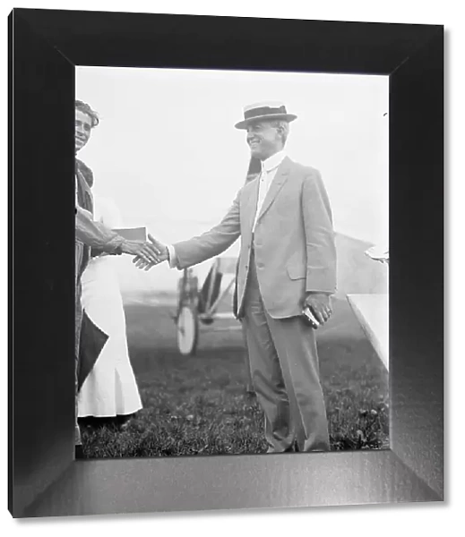 Maj. Edgar Russell, Signal Corps, U.S.A. Right, Shaking Hands with Aviator Wood, 1911. Creator: Harris & Ewing. Maj. Edgar Russell, Signal Corps, U.S.A. Right, Shaking Hands with Aviator Wood, 1911. Creator: Harris & Ewing