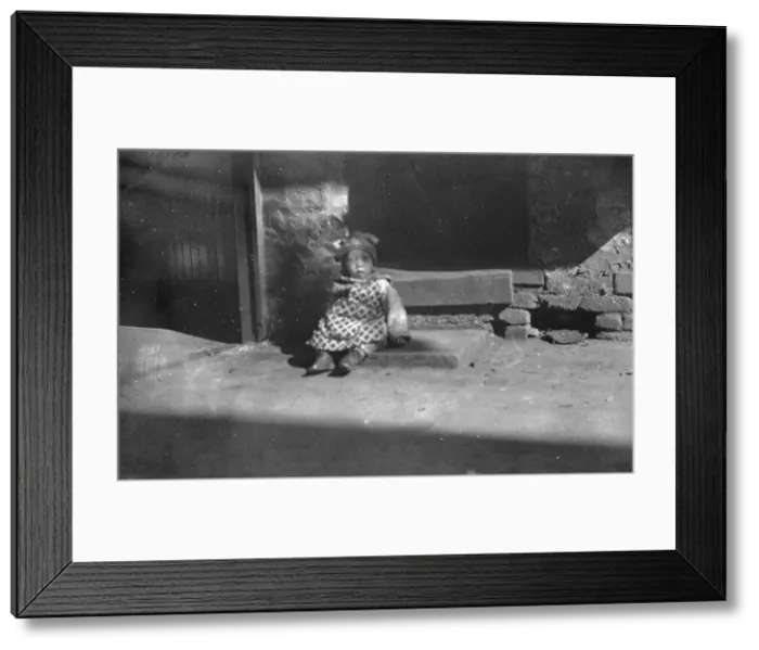 Framed Print : Small child sitting on a doorstep, Chinatown, San Francisco, between 1896 and 1906. Creator: Arnold Genthe Framed Print : Small child sitting on a doorstep, Chinatown, San Francisco, between 1896 and 1906. Creator: Arnold Genthe