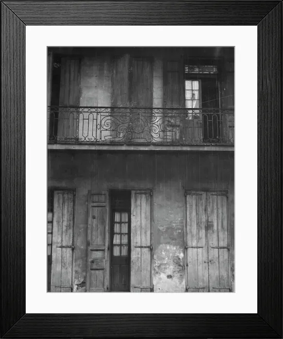 Framed Print : Facade of a building with shuttered doors and balcony, New Orleans or Charleston... c1920-1926. Creator: Arnold Genthe Framed Print : Facade of a building with shuttered doors and balcony, New Orleans or Charleston... c1920-1926. Creator: Arnold Genthe
