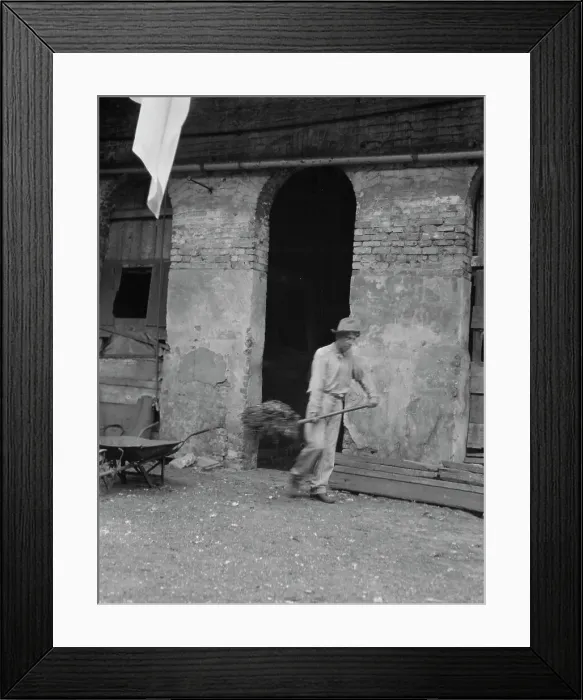 Framed Print : Man cleaning out a small building, New Orleans or Charleston, South Carolina, between 1920 and 1926. Creator: Arnold Genthe Framed Print : Man cleaning out a small building, New Orleans or Charleston, South Carolina, between 1920 and 1926. Creator: Arnold Genthe