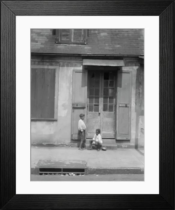 Framed Print : Two children outside a door with shutters in the French Quarter, New Orleans, between 1920 and 1926. Creator: Arnold Genthe Framed Print : Two children outside a door with shutters in the French Quarter, New Orleans, between 1920 and 1926. Creator: Arnold Genthe