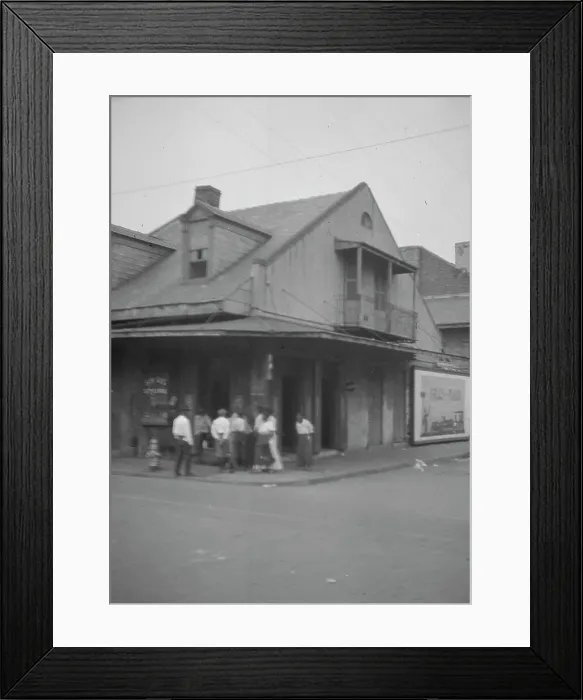 Framed Print : View from across street of a group of men on a street corner, New Orleans, between 1920 and 1926. Creator: Arnold Genthe Framed Print : View from across street of a group of men on a street corner, New Orleans, between 1920 and 1926. Creator: Arnold Genthe