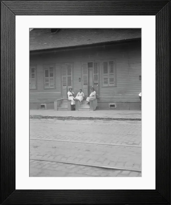 Framed Print : View from across street of three women talking, New Orleans or Charleston, South Ca. c1920-c1926. Creator: Arnold Genthe Framed Print : View from across street of three women talking, New Orleans or Charleston, South Ca. c1920-c1926. Creator: Arnold Genthe