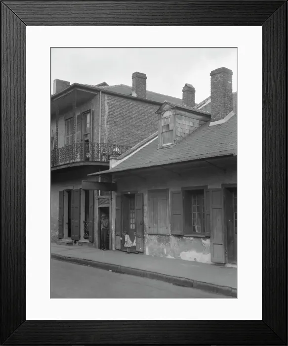 Framed Print : View from across street of two children standing in a doorway in the French Quarter... c1920-1926. Creator: Arnold Genthe Framed Print : View from across street of two children standing in a doorway in the French Quarter... c1920-1926. Creator: Arnold Genthe