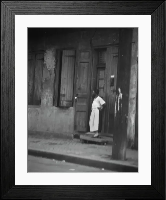 Framed Print : Woman standing in a doorway in the French Quarter, New Orleans, between 1920 and 1926. Creator: Arnold Genthe Framed Print : Woman standing in a doorway in the French Quarter, New Orleans, between 1920 and 1926. Creator: Arnold Genthe