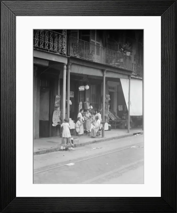Framed Print : Women and children standing on a covered sidewalk, New Orleans, between 1920 and 1926. Creator: Arnold Genthe