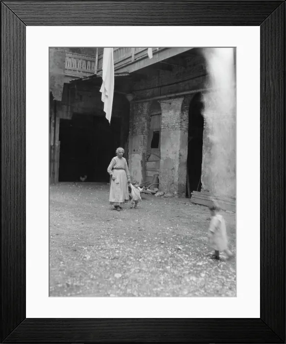 Framed Print : Woman and children in a courtyard, New Orleans, between 1920 and 1926. Creator: Arnold Genthe Framed Print : Woman and children in a courtyard, New Orleans, between 1920 and 1926. Creator: Arnold Genthe