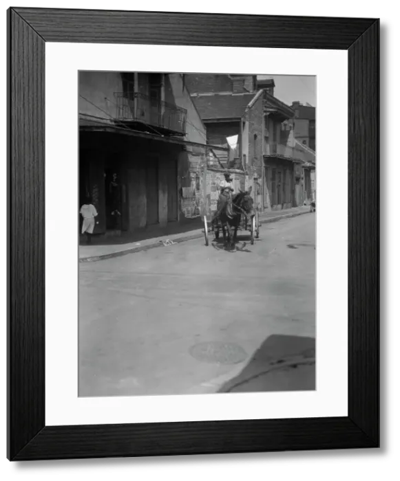 Framed Print : Street scene in the French Quarter, New Orleans, between 1920 and 1926. Creator: Arnold Genthe Framed Print : Street scene in the French Quarter, New Orleans, between 1920 and 1926. Creator: Arnold Genthe