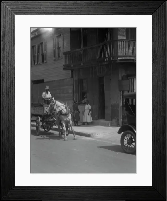 Framed Print : Street scene, including horse- or mule-drawn wagon, New Orleans, between 1920 and 1926. Creator: Arnold Genthe