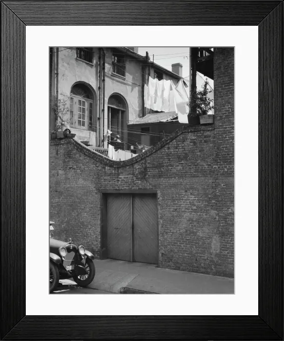 Framed Print : Courtyard with a garage, New Orleans, between 1920 and 1926. Creator: Arnold Genthe Framed Print : Courtyard with a garage, New Orleans, between 1920 and 1926. Creator: Arnold Genthe