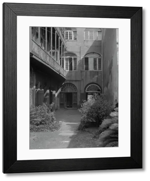 Framed Print : Courtyard, New Orleans, between 1920 and 1926. Creator: Arnold Genthe Framed Print : Courtyard, New Orleans, between 1920 and 1926. Creator: Arnold Genthe