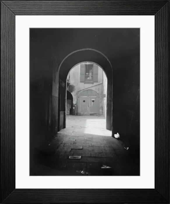 Framed Print : View of a courtyard through an arched passageway, New Orleans, between 1920 and 1926. Creator: Arnold Genthe Framed Print : View of a courtyard through an arched passageway, New Orleans, between 1920 and 1926. Creator: Arnold Genthe