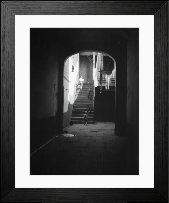 Framed Print : View of a courtyard through an arched passageway, New Orleans, between 1920 and 1926. Creator: Arnold Genthe Framed Print : View of a courtyard through an arched passageway, New Orleans, between 1920 and 1926. Creator: Arnold Genthe