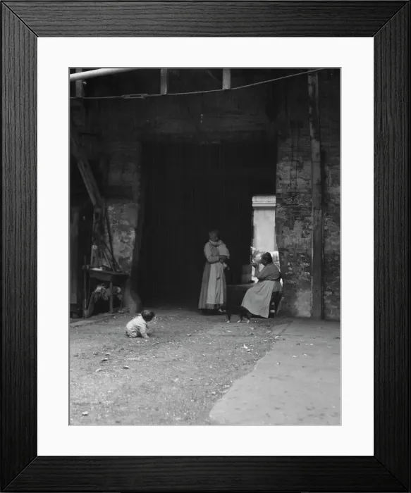 Framed Print : Women and children in a courtyard, New Orleans, between 1920 and 1926. Creator: Arnold Genthe Framed Print : Women and children in a courtyard, New Orleans, between 1920 and 1926. Creator: Arnold Genthe