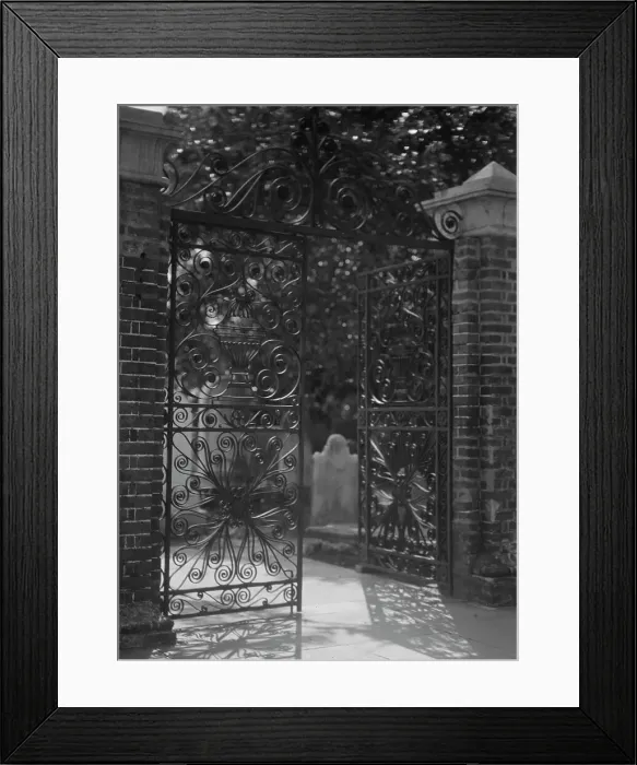 Framed Print : Gates on Broad Street to the graveyard at St. Michael's Episcopal Church, Charleston... c1920-1926. Creator: Arnold Genthe Framed Print : Gates on Broad Street to the graveyard at St. Michael's Episcopal Church, Charleston... c1920-1926. Creator: Arnold Genthe