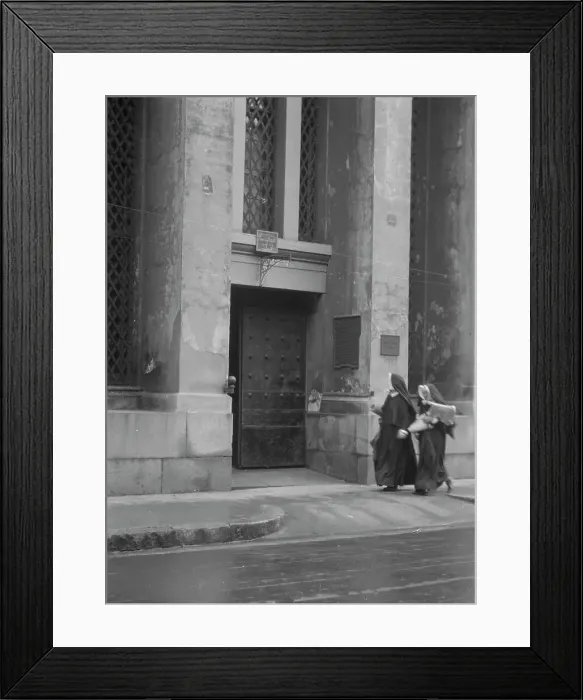 Framed Print : Sisters of Charity and the gateway of the Armory, New Orleans, between 1920 and 1926. Creator: Arnold Genthe Framed Print : Sisters of Charity and the gateway of the Armory, New Orleans, between 1920 and 1926. Creator: Arnold Genthe