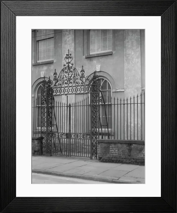 Framed Print : Unidentified building behind a fence, New Orleans or Charleston, South Carolina, c1920-1926. Creator: Arnold Genthe Framed Print : Unidentified building behind a fence, New Orleans or Charleston, South Carolina, c1920-1926. Creator: Arnold Genthe