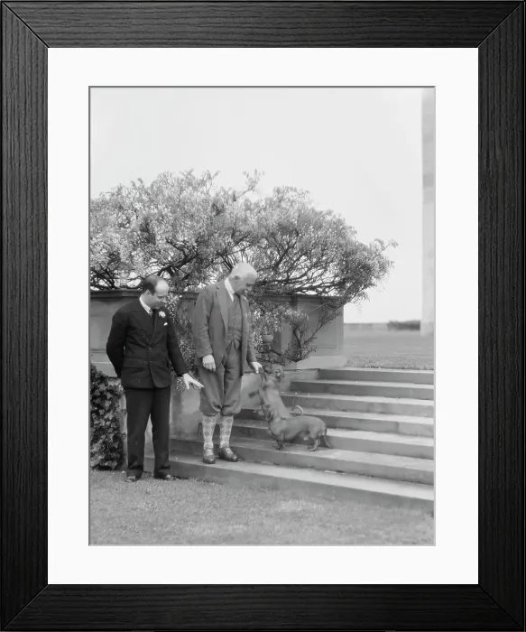 Framed Print : Kahn, Otto H. Mr. and unidentified man, with dog, standing outdoors, 1928 Creator: Arnold Genthe Framed Print : Kahn, Otto H. Mr. and unidentified man, with dog, standing outdoors, 1928 Creator: Arnold Genthe