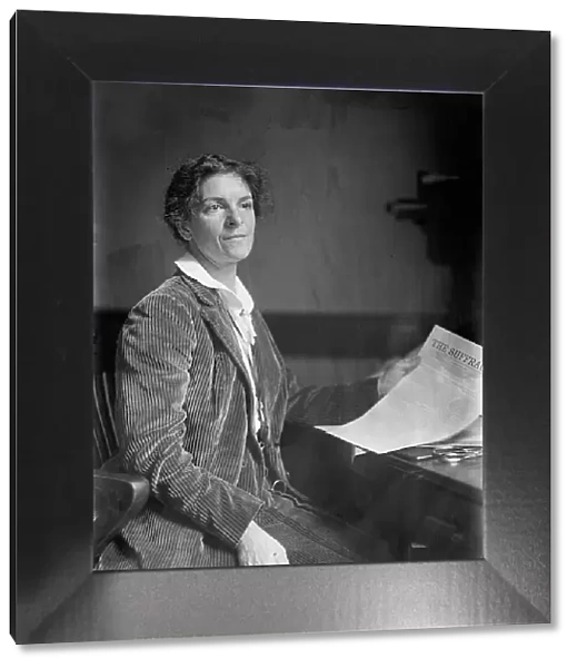 Mrs. Rheta C. Dorr, Suffragist, with First Edition of The Suffragist, 1913. Creator: Harris & Ewing. Mrs. Rheta C. Dorr, Suffragist, with First Edition of The Suffragist, 1913. Creator: Harris & Ewing