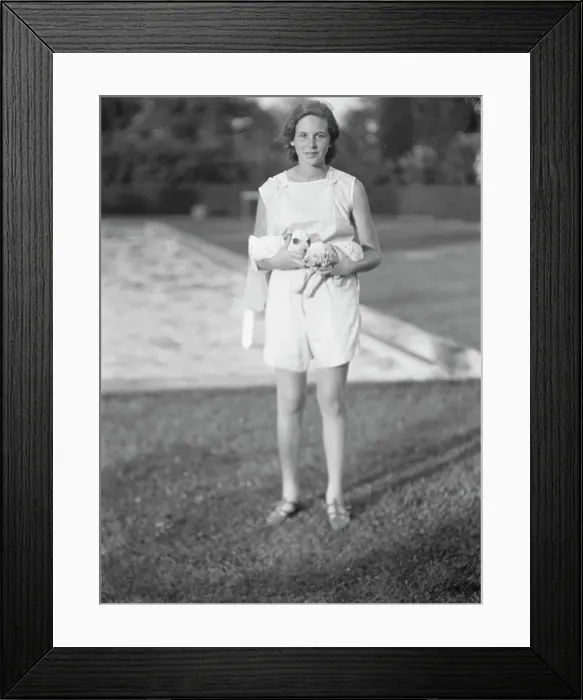 Framed Print : Rossbach, Miss, holding puppies, standing outdoors, 1932 June 30. Creator: Arnold Genthe Framed Print : Rossbach, Miss, holding puppies, standing outdoors, 1932 June 30. Creator: Arnold Genthe
