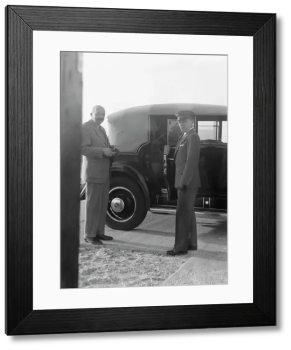 Framed Print : Rothbart, Albert, Mr. standing by his car with his chauffeur, between 1920 and 1935. Creator: Arnold Genthe Framed Print : Rothbart, Albert, Mr. standing by his car with his chauffeur, between 1920 and 1935. Creator: Arnold Genthe
