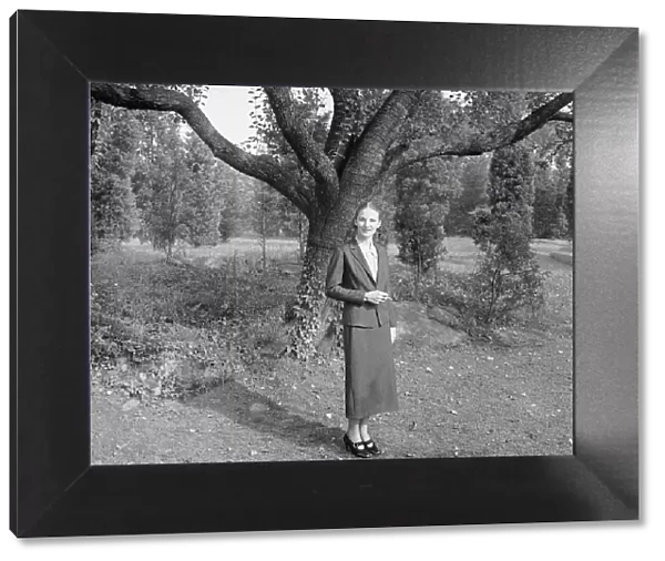 Ruth, standing outdoors by a tree, 1936 Creator: Arnold Genthe