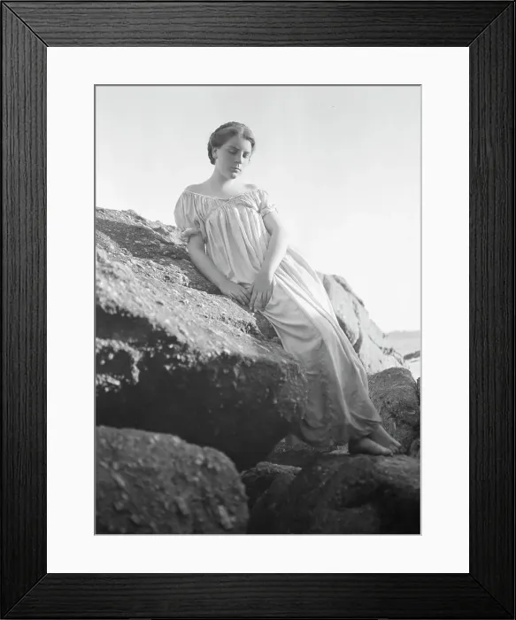 Framed Print : Wilson, Helen, Mrs. seated on rocks at the beach, between 1906 and 1928. Creator: Arnold Genthe Framed Print : Wilson, Helen, Mrs. seated on rocks at the beach, between 1906 and 1928. Creator: Arnold Genthe