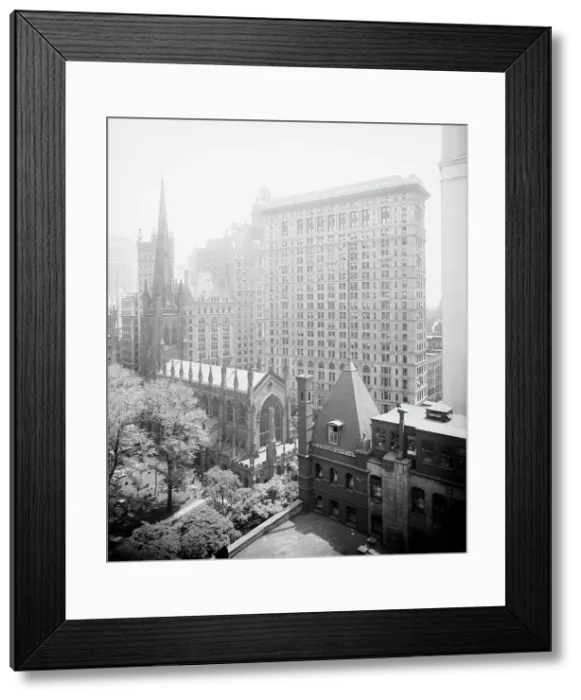 Framed Print : New York, N.Y. Trinity churchyard and the skyscrapers, between 1900 and 1920. Creator: Unknown Framed Print : New York, N.Y. Trinity churchyard and the skyscrapers, between 1900 and 1920. Creator: Unknown