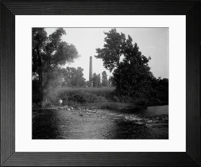 Framed Print : Smokestack by river, probably the Huron River, Ypsilanti, Michigan, between 1900 and 1910. Creator: Unknown Framed Print : Smokestack by river, probably the Huron River, Ypsilanti, Michigan, between 1900 and 1910. Creator: Unknown