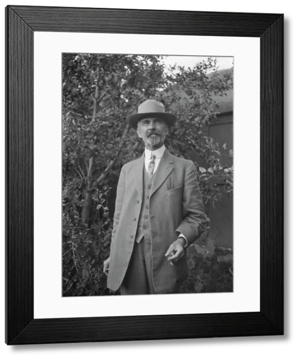 Framed Print : Unidentified man, standing outdoors, between 1896 and 1942. Creator: Arnold Genthe Framed Print : Unidentified man, standing outdoors, between 1896 and 1942. Creator: Arnold Genthe