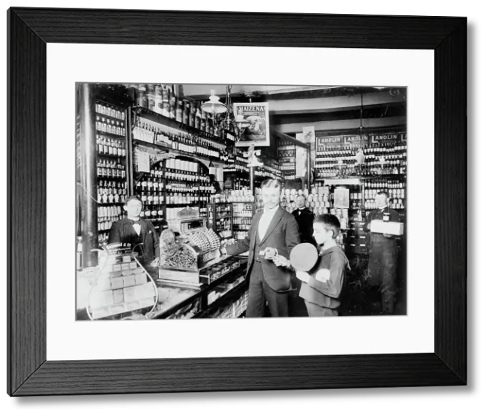 Framed Print : Unidentified grocery store, probably in Germany, between 1900 and 1910. Creator: Unknown Framed Print : Unidentified grocery store, probably in Germany, between 1900 and 1910. Creator: Unknown