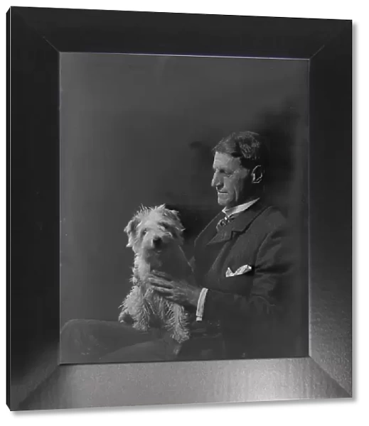 Mr. Arthur Young, with dog, portrait photograph, 1918 Oct. 1. Creator: Arnold Genthe