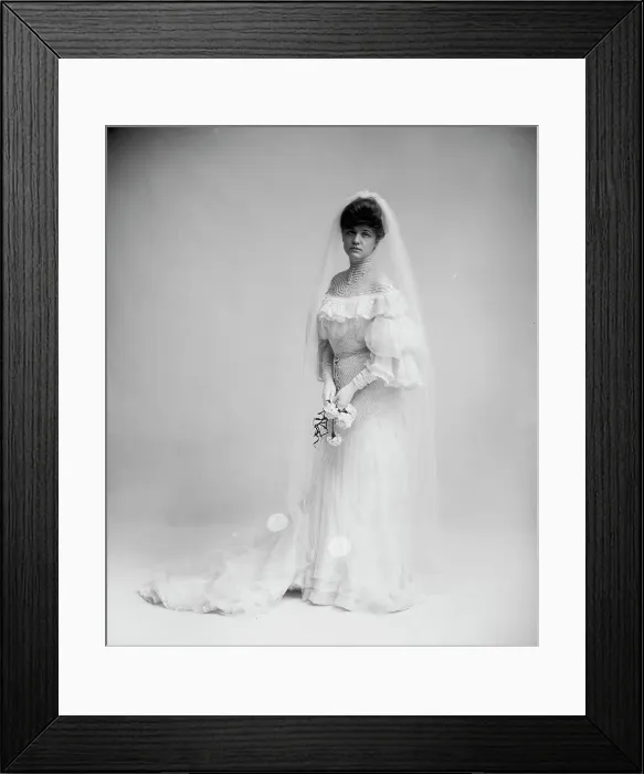 Framed Print : Woman in wedding dress holding flowers, between 1900 and 1910. Creator: Unknown Framed Print : Woman in wedding dress holding flowers, between 1900 and 1910. Creator: Unknown