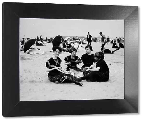 Picnicing on the beach, between 1900 and 1905. Creator: Unknown