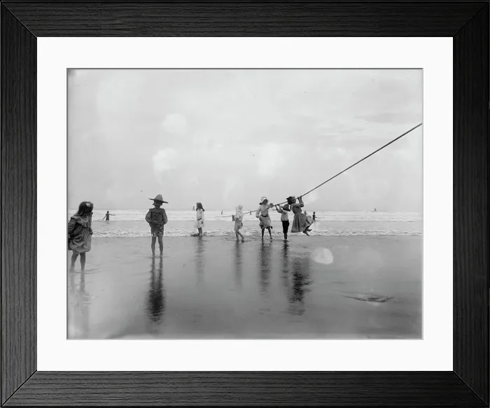 Framed Print : Children swinging on pier rope at beach, between 1900 and 1910. Creator: Unknown Framed Print : Children swinging on pier rope at beach, between 1900 and 1910. Creator: Unknown