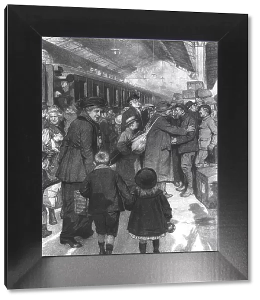 Rapatries; l'arrivee d'un train a Evian: des territoriaux de service sur le quai sont... 1917. Creator: J Simont