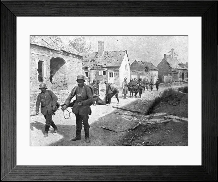 Framed Print : A travers le champ de bataille; prisonniers allemands traversant un village reconquis... 1918. Creator: Unknown Framed Print : A travers le champ de bataille; prisonniers allemands traversant un village reconquis... 1918. Creator: Unknown