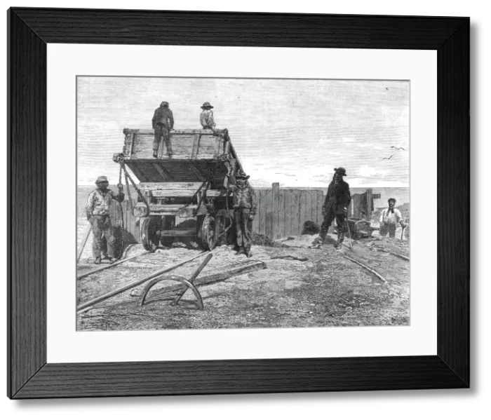 Framed Print : Discharging Guano-Wagons; About the Chincha Islands, 1875. Creator: Unknown Framed Print : Discharging Guano-Wagons; About the Chincha Islands, 1875. Creator: Unknown