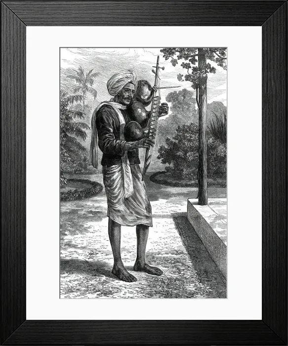 Framed Print : A strolling minstrel at Madras playing the tingadee, 1876. Creator: Unknown Framed Print : A strolling minstrel at Madras playing the tingadee, 1876. Creator: Unknown