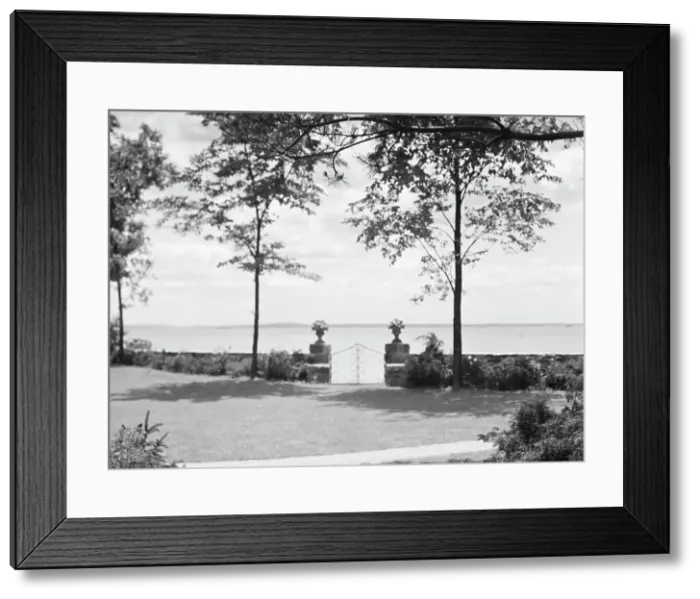 Framed Print : Garden overlooking water, East Hampton, Long Island, between 1933 and 1942. Creator: Arnold Genthe Framed Print : Garden overlooking water, East Hampton, Long Island, between 1933 and 1942. Creator: Arnold Genthe