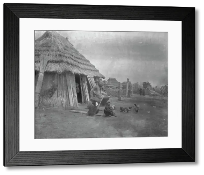 Framed Print : Group of Ainu outside a hut, 1908. Creator: Arnold Genthe Framed Print : Group of Ainu outside a hut, 1908. Creator: Arnold Genthe