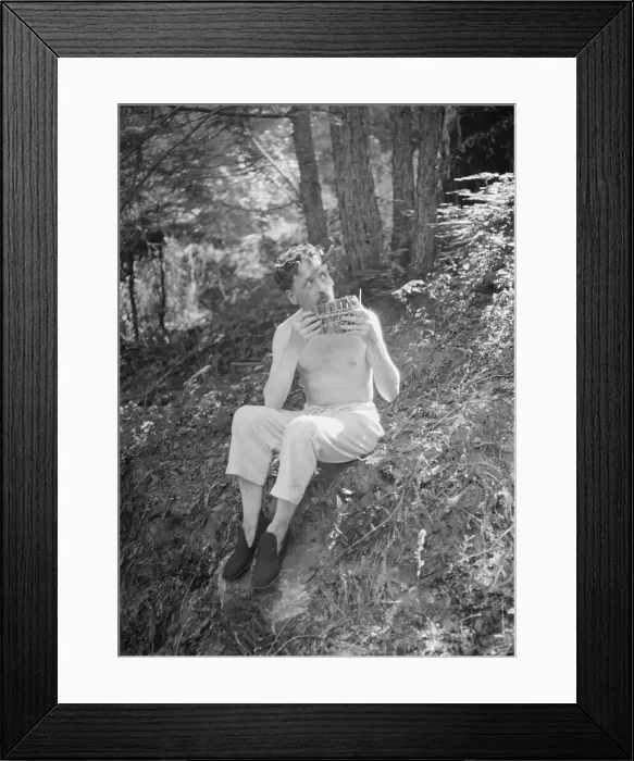 Framed Print : Man playing panpipes in the woods, between 1911 and 1942. Creator: Arnold Genthe Framed Print : Man playing panpipes in the woods, between 1911 and 1942. Creator: Arnold Genthe