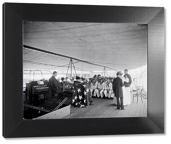 U.S.S. Texas, presentation of cross and badge to Ensign Gherardi by the King's... Aug. 8, 1897. Creator: Unknown