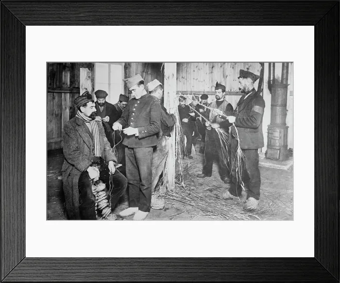 Framed Print : Prisoners at Zossen making straw shoes, 24 Feb 1915. Creator: Bain News Service Framed Print : Prisoners at Zossen making straw shoes, 24 Feb 1915. Creator: Bain News Service