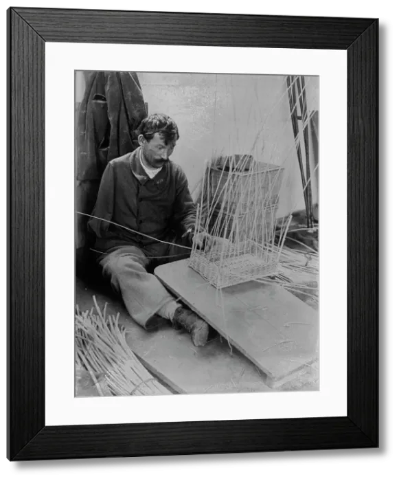 Framed Print : Fernand Bihery [making baskets, French School for crippled soldiers], 1918. Creator: Bain News Service